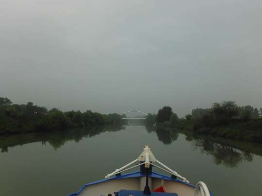 Rollin' on the river. A calm and misty morning cruising to our departure point.